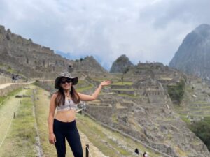 Venni Yu standing at the famous lookout point over Machu Picchu in Peru