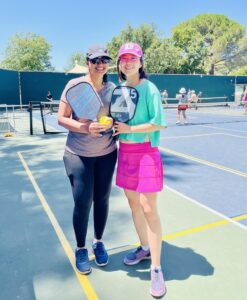 Yating Zhuang poses with a friend on the pickleball court