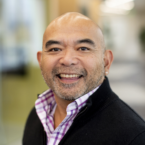 Headshot of Cesar Agustin, by photographer Ruby Wallau