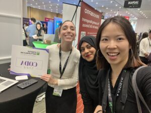 Yi and Aisha pose with a member of the team CODA from the Startup Battlefield event