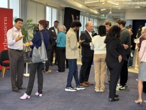 Students gather around Senator Cortese in conversation after the panel discussion