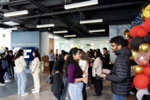 Alumni in small groups chatting during one of the alumni mixers on campus