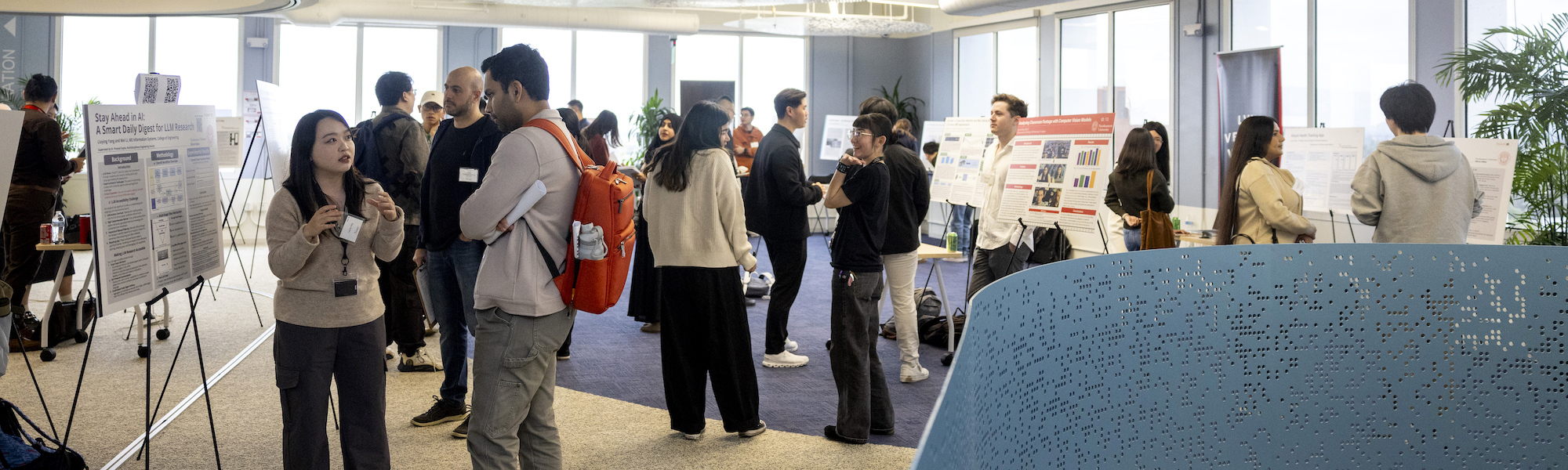 Students mingling at the research showcase. Photo by Ruby Wallau