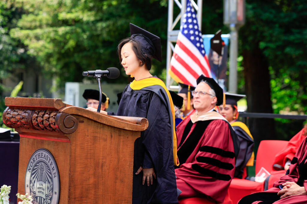 Ashley Ting Li stands at the podium delivering her remarks