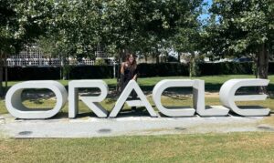 Songting poses with the Oracle sign on the company's campus during her internship there