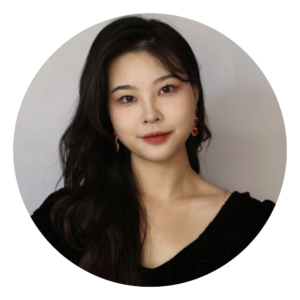 A headshot photo against a studio background